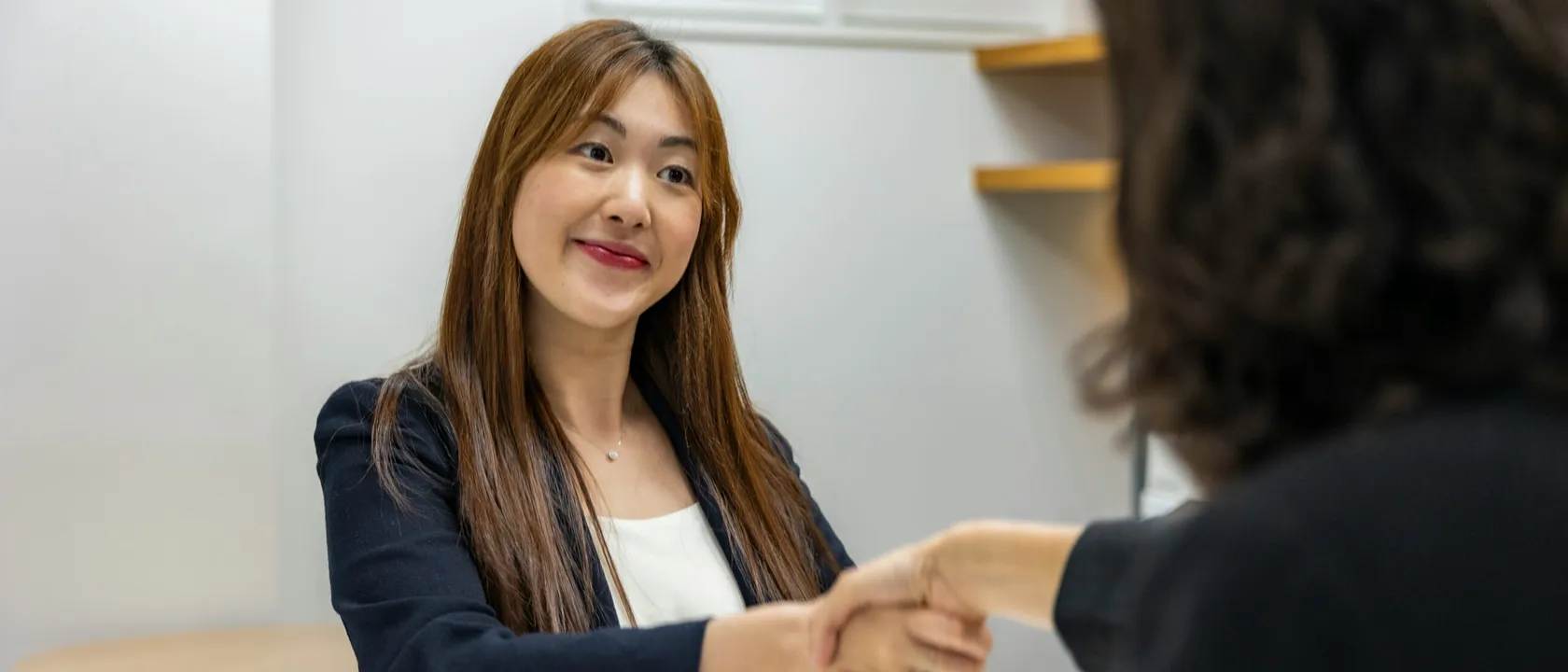Women shaking hands