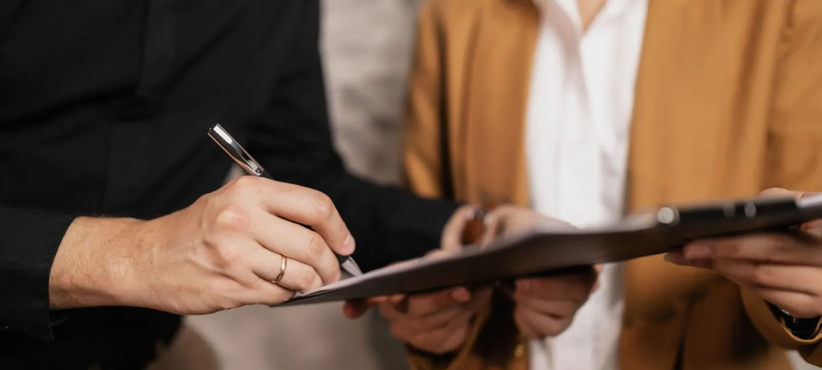 Two parties signing a professional contract